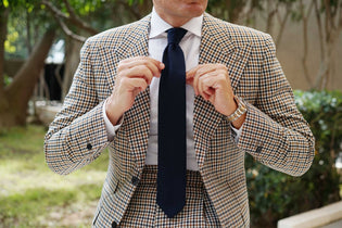 OTAA Matutine Navy Knitted Tie worn with checked tailoring