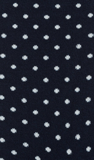 Close-up of navy sock fabric with small white dots