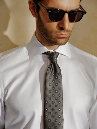 OTAA Windsor Royal White Shirt with Pewter Crest grey patterned necktie and dark sunglasses