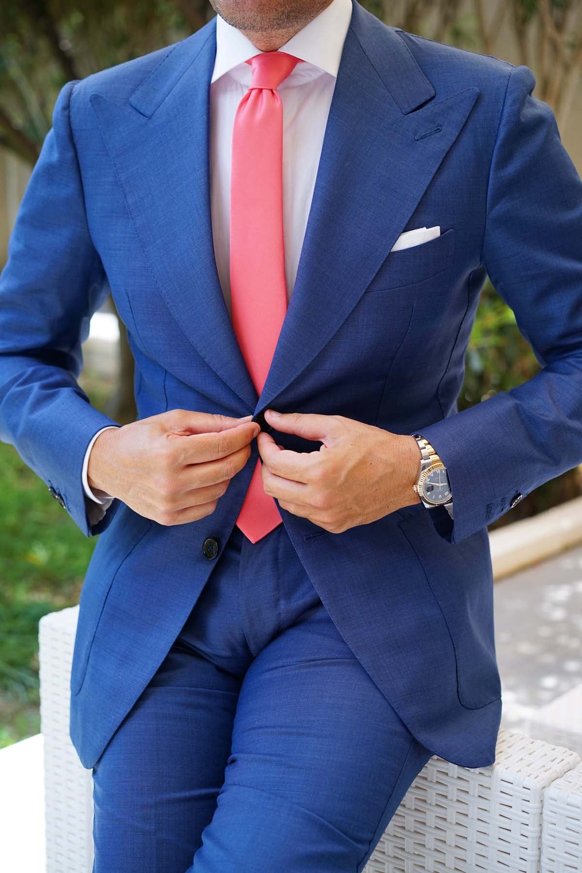 coral tie blue suit
