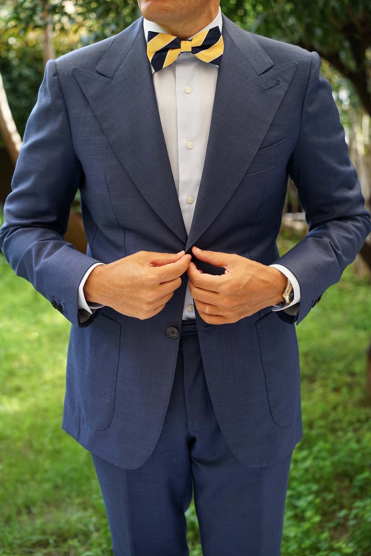 navy blue tux with yellow bow tie